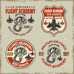 Flight academy set of vector emblems, badges, labels, logos in vintage style with grunge textures and scratches © Flat_Enot