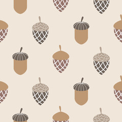 Seamless autumn pattern. Acorns on beige background. Vector illustration.
