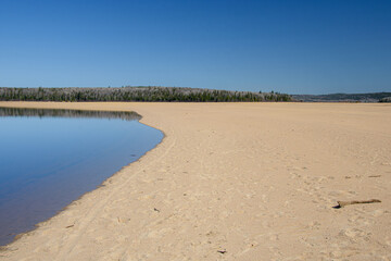 In spring, beautiful lake in the Canadian forest in the province of Quebec