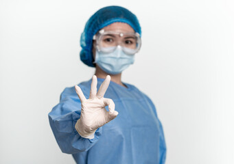 People in protective suit and medical mask on white background showing ok gesture