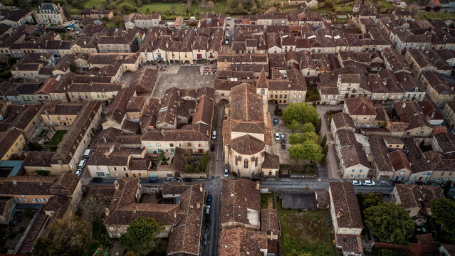 Top wide drone view of the beautiful little village of Monpazier in P&eacute;rigord at sunset, Dordogne