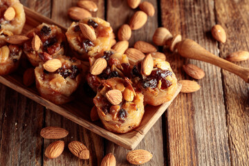 Obraz na płótnie Canvas Small cakes with almonds, raisins, and honey.