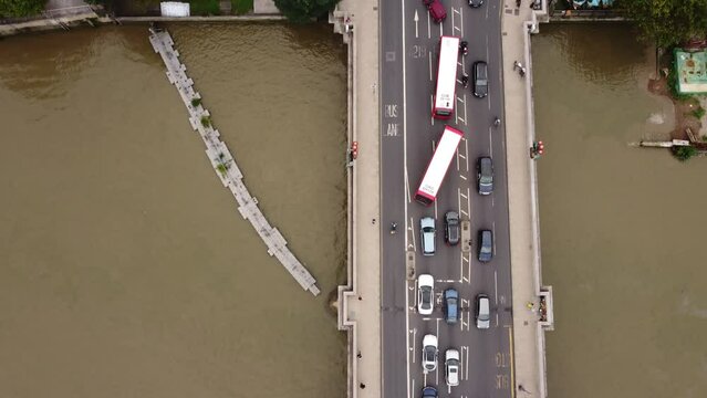 Top view of the Putney Bridge and road junction on the shore.