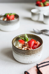 Strawberry, cream cheese and feta cream and crumble crust dessert. Homemade Sweet and salty cheesecake. Trifle. Selective focus