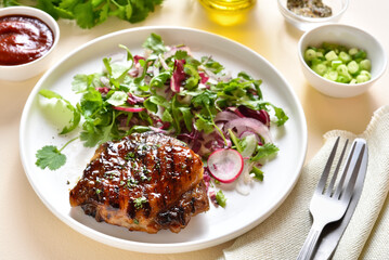 Roasted pork steak with salad from fresh vegetable