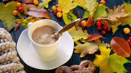 Autumn mood with hot cappuccino coffee with high foam