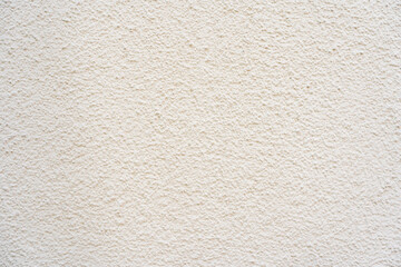 Bright plaster of a house wall with a strong structure