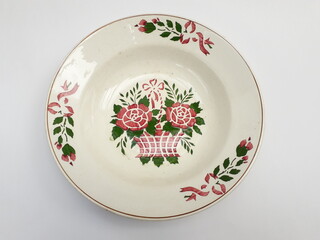 Vintage porcelain wall plate with spray painted folk art pattern