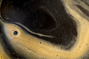 Coffee texture background. Strong espresso extreme dark coffee brown froth closeup