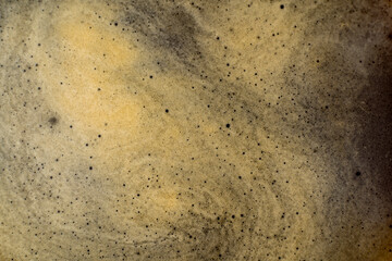 Coffee texture background. Strong espresso extreme dark coffee brown froth closeup