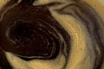 Coffee texture background. Strong espresso extreme dark coffee brown froth closeup