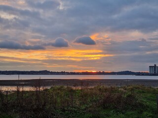 Obraz premium sunset over the river