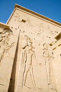 Egypt, Aswan, Philae Island, Giant carvings on first pylon at Temple of Isis