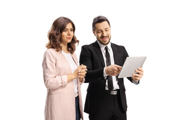Fototapeta na wymiar Professional man in a black suit showing a digital tablet to a woman