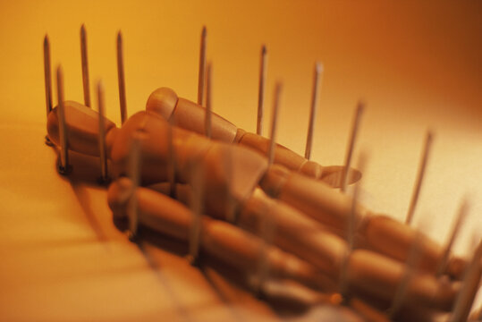 Doll on a bed of nails