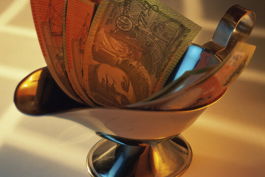 Close-up of banknotes in a magic lamp