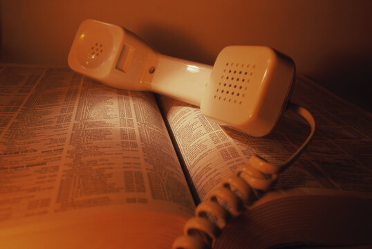 Telephone receiver on a telephone directory