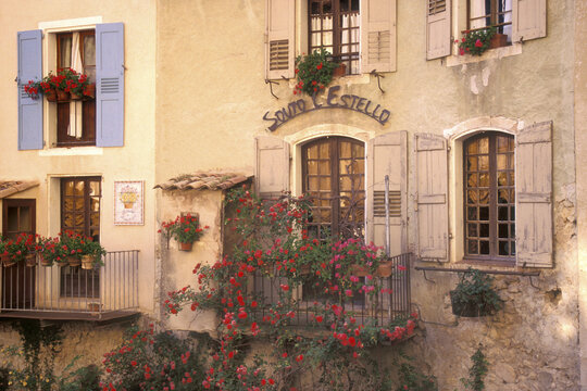 Potted plants outside of windows, Moustiers-Sainte Marie, France