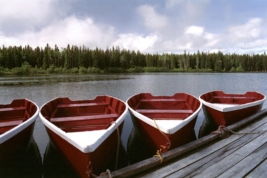 Four rowboats docked at a dock, Hi Hium Lake, British Columbia, Canada