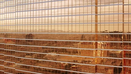 Breathtaking shiny golden glass skyscraper building closeup aerial on sunny day. Epic city reflection in cinematic bronze gold glass of modern design architecture business office. Scenic aerial view