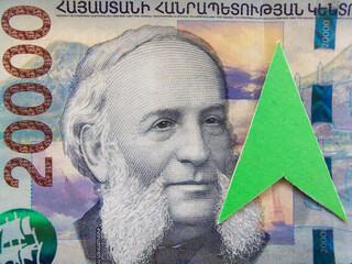 The concept of raising the Armenian Drama course. Part of the 20000 dram banknote. The green arrow...