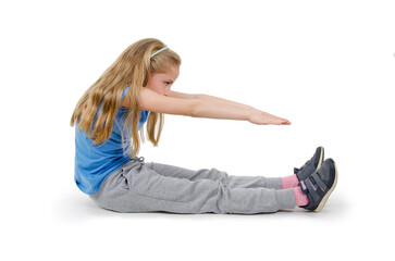 Girl child practicing yoga, working out, wearing sportswear, full length, isolated on white background. Happy little girl goes in for sports. studio shot.