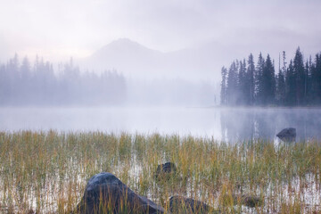 Fog over a lake at sunrise, Scott Lake, Willamette National Forest, Oregon, USA