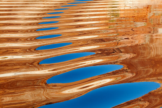 Reflection of rocks in a lake, Lake Powell, Glen Canyon National Recreation Area, Utah, USA