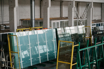 Factory for aluminum and PVC windows and doors production. Details industrial equipment.