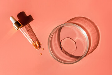 Laboratory glass petri with pipette and drop of water, serum, oil, beauty product. Natural medicine, cosmetic research, bio science. Concept of skincare and analysis. Dermatology. Flat lay, top view