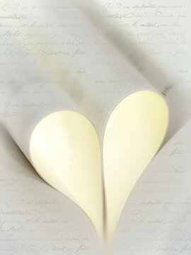 Pages in book folded to form heart