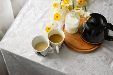 Breakfast table seating with coffee cup and milk