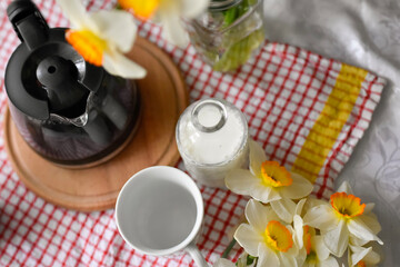 Breakfast table seating with coffee cup and milk