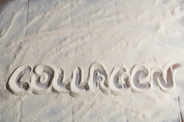 Fototapeta premium Collagen powder background. Collagen inscription. Top view, flat lay.