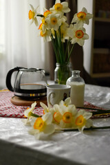 Breakfast table seating with coffee cup and milk