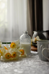 still life with a glass of milk and eggs
