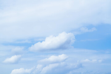Cumulus clouds. White clouds on a blue background.