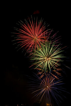 Low angle view of fireworks display at night