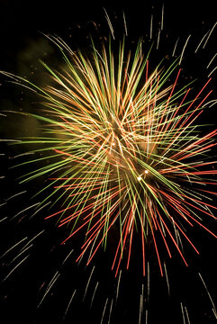 Low angle view of fireworks display at night