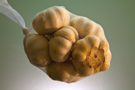 Close up of garlic in net bag