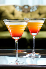 Two glasses of cocktail on a serving tray