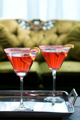 Two glasses of cocktail on a serving tray