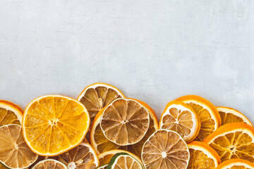 dried citrus fruits on a grey metallic background, space for text. High quality photo