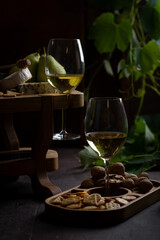 Glass of white wine in a dark room