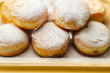 Berliner Pfannkuchen, a German donut, traditional yeast dough deep fried filled with chocolate...