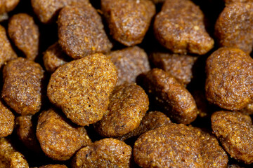 Dog or cat food or kibble shot up close. Top view background
