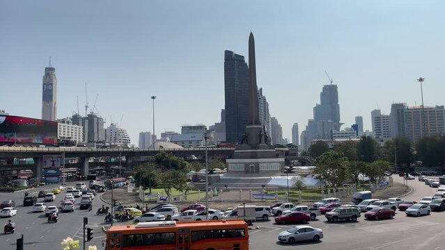 Victory monument, known as Anusawari Chai Samoraphum panoramic view sunny day. Roundabout traffic vehicles on road, blue sky cityscape 