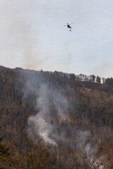 helicopter in flight putting out fire