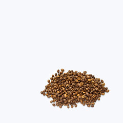  .Heap of roasted coffee beans on white with copy space. Detailed image of coffee beans.Heap of roasted coffee beans on white with copy space. Detailed image of coffee beans.