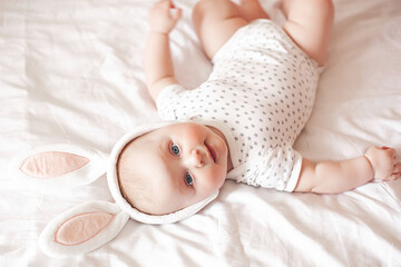 Cute little baby indoors. Baby closeup portrait on neutral background
